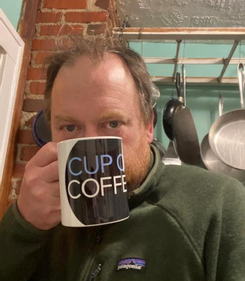 Reader Frank Schloegel, holding a Cup of Coffee coffee mug