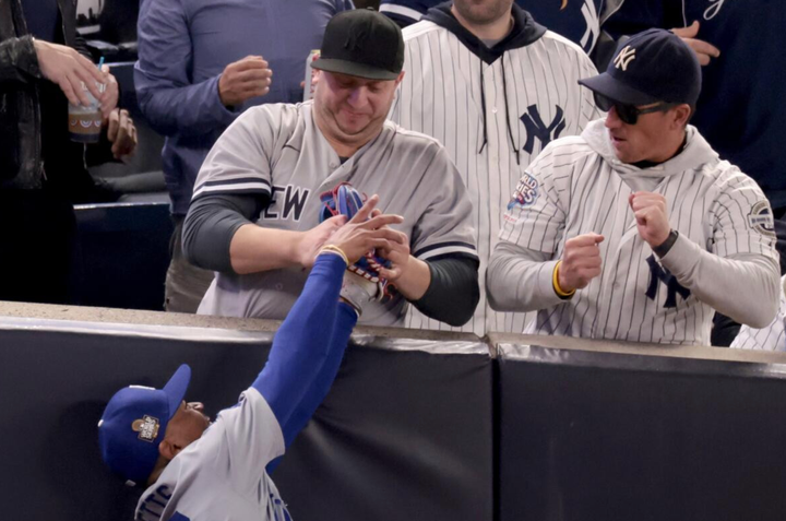 Those Yankees fan guys trying to steal the baseball from Mookie Betts during Game 4 of the World Series