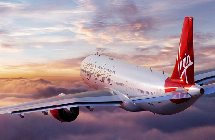 A Virgin Atlantic plane flying into a sunset. Or maybe a sunrise. Hell, I don't know but it looks boss.