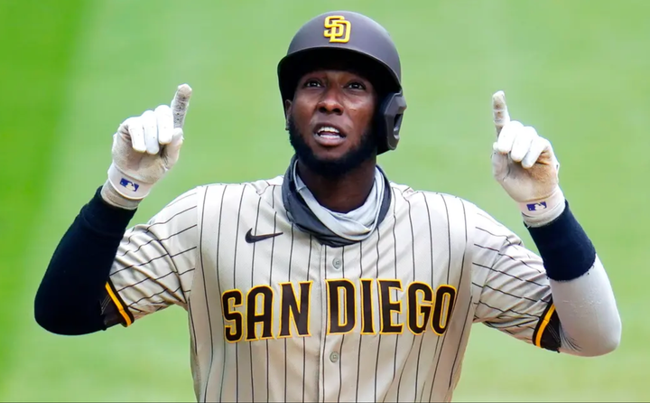 Jurickson Profar with two arms raised in the air.