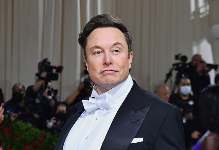 Elon Musk in a tuxedo, looking, as always, like the world's biggest dipshit. May he die in prison.