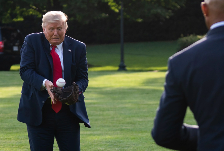 Trump awkwardly trying to catch a baseball that was tossed to him by Mariano fucking Rivera of all people, my god Mariano, why